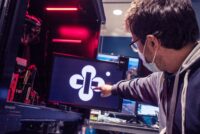 Jerome Lecoq points to an optical illusion graphic on a computer screen