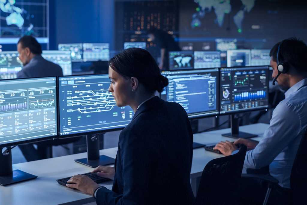 IT professionals / programmers / engineers / developers in a modern workspace.